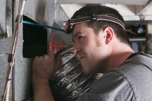 Tech working on furnace in Monroe Township, NJ.