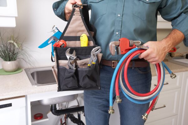 Plumber with Plumbing tools in Monroe Township, NJ.