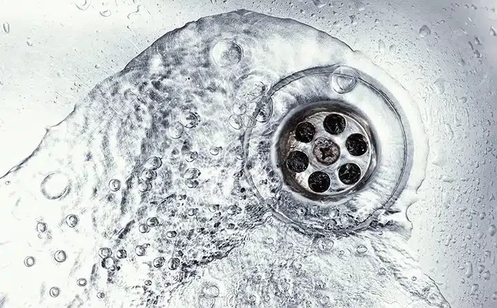 Water flowing down drain in Monroe Township, NJ.