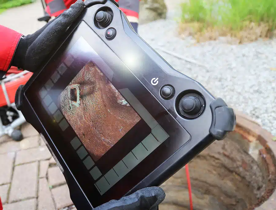 tech completing a video camera sewer inspections